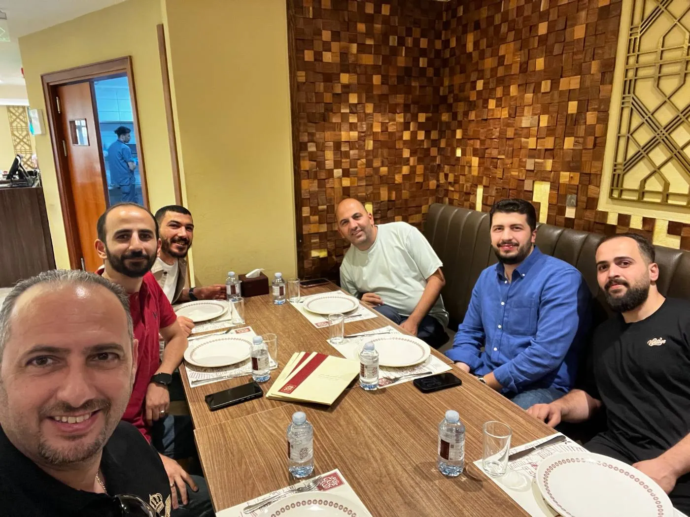 Team gathered around a restaurant table